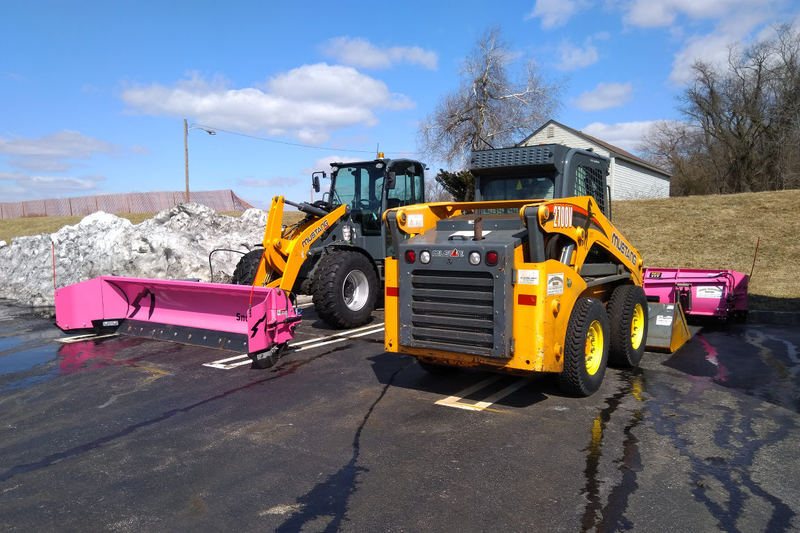 Ready to plow snow and piles of pink ribbons